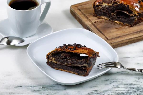 Slice of chocolate coffee cake ready to eat