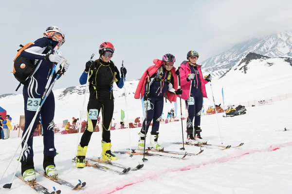 Girls ski mountaineers at the starting line. Team Race ski mountaineering. Russian, Kamchatka