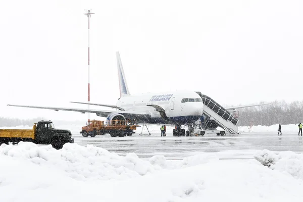 Service and technical support airfield maintenance airplane at airport of Petropavlovsk-Kamchatsky (Elizovo airport). Kamchatka, Far East, Russia