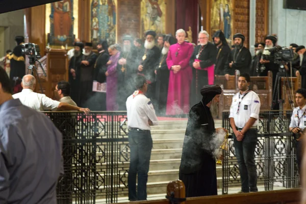 An Orthodox priest burns incense during a sermon