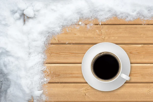 Cup coffee with snow