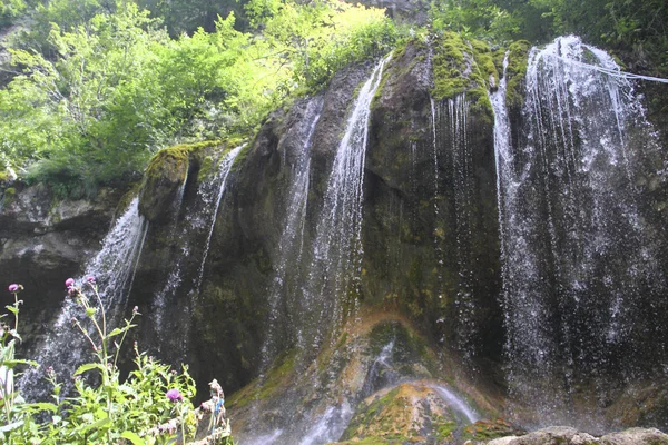 Beautiful waterfall falling off a cliff, Chegem Gorge,  Caucasus