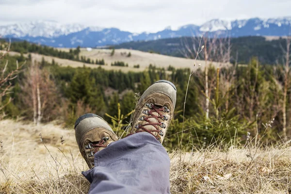 Hiking boots on mountain background
