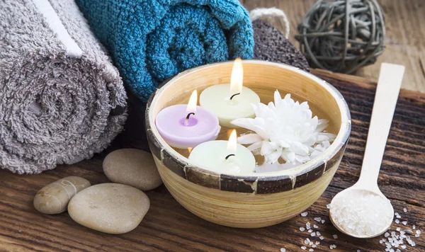 Spa.Burning Candles in the Water, Cotton Towels and Bath Salt