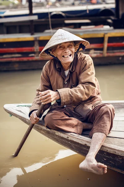Old man on a boat in river,Vietnam.