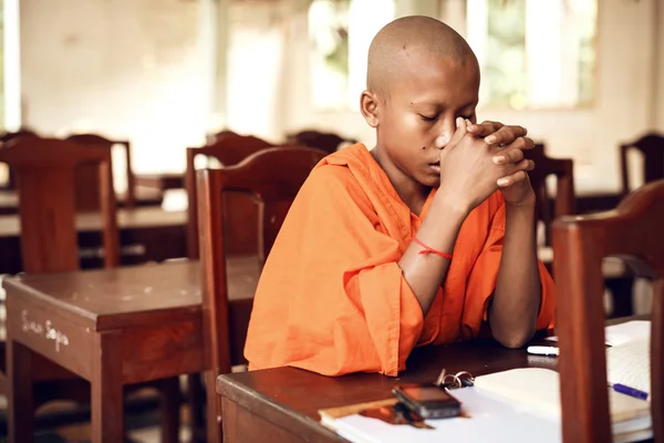 Buddhist monks learning on classroom
