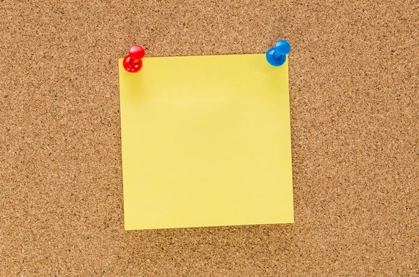 Cork board with blank note