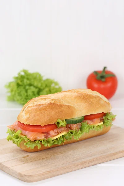 Sub deli sandwich baguette with salmon fish and copyspace copy s