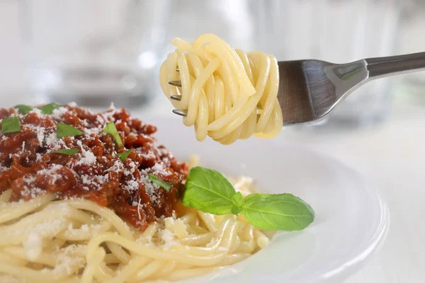 Eating spaghetti Bolognese noodles pasta meal with fork