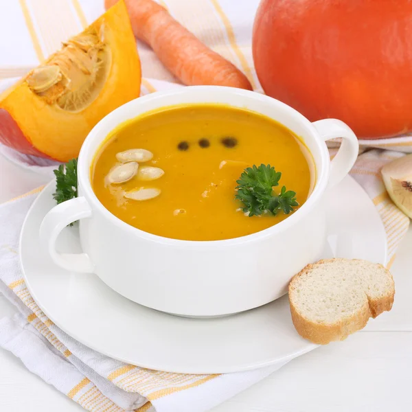 Pumpkin soup with pumpkins in cup healthy eating