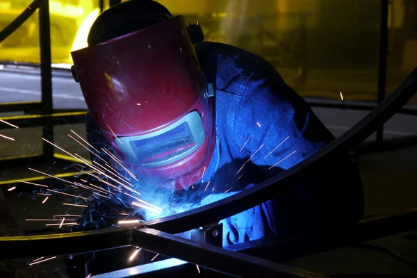 Man welding in a factory