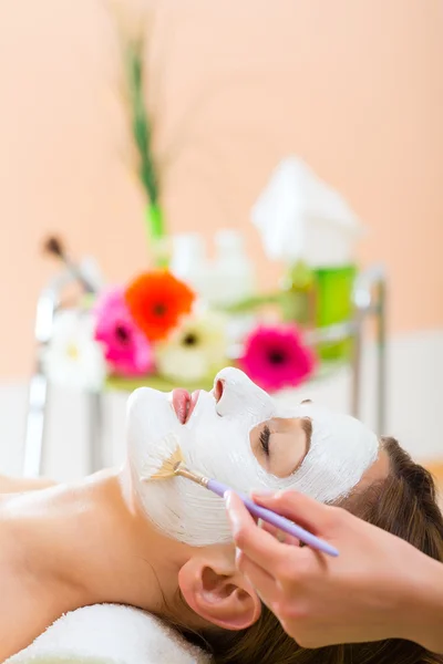 Woman getting face mask