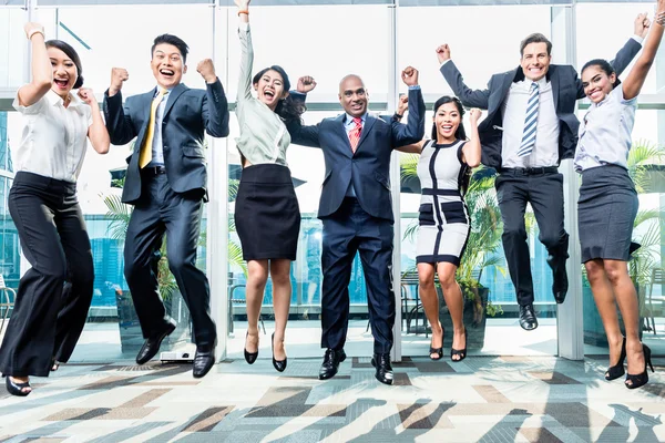 Diversity business team jumping