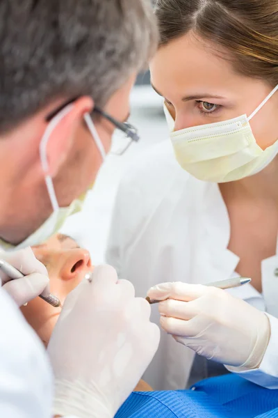 Patient with Dentist - dental treatment