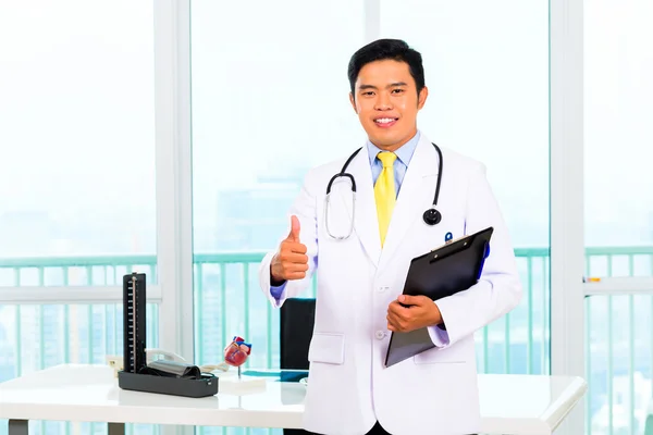 Asian doctor in office or medical surgery