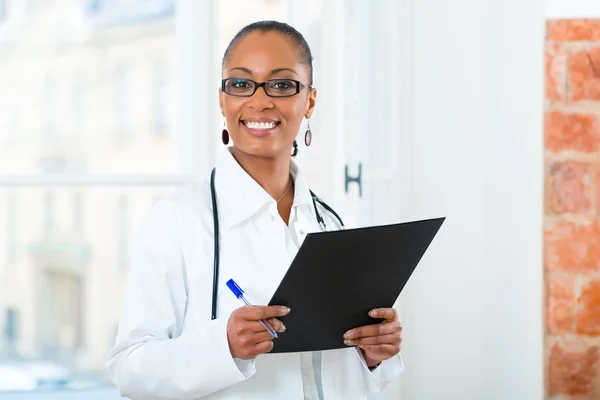 Portrait of young female doctor in clinic