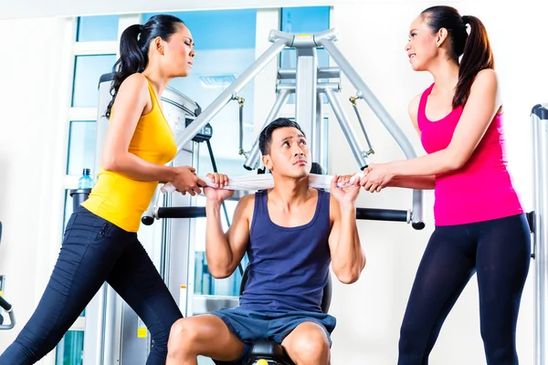 Women fighting over man at gym