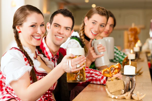 People in traditional Bavarian Tracht in restaurant or pub