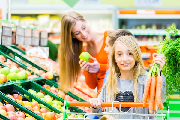 Family grocery shopping in hypermarket