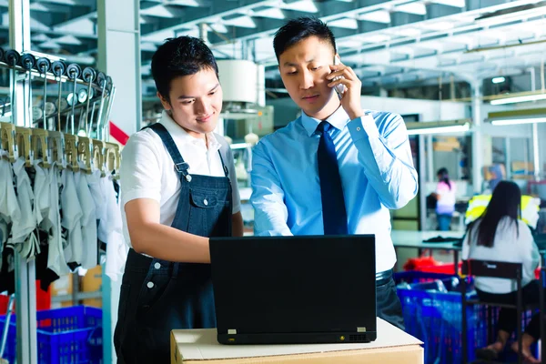 Worker and customer service of a factory