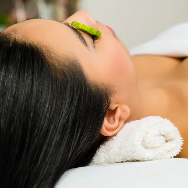 Asian woman getting a facial treatment in spa