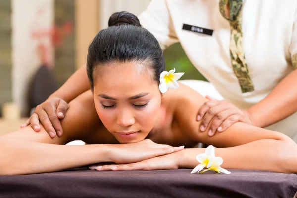 Indonesian woman wellness massage in spa