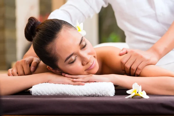 Indonesian woman wellness massage in spa