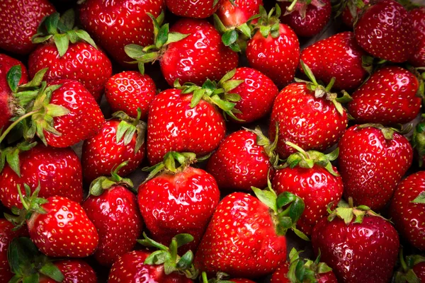 Food background with plenty of ripe strawberry