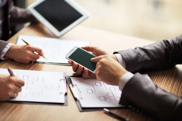 Business team working on a scheme business using the tablet and smartphone