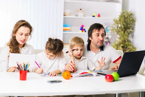 Kind, happy family relaxing at home.