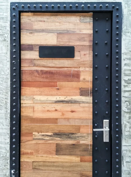 Wooden door with metal frame