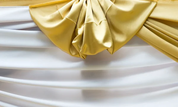 Golden and wihtie fabric strip