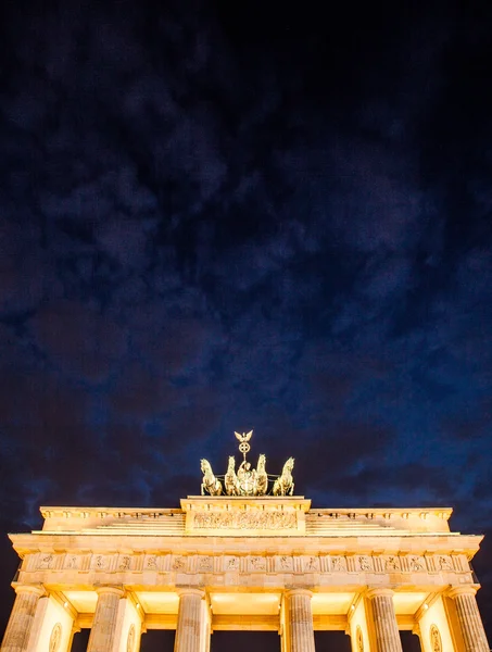 Germany, Berlin - September 29, 2014. Close-up on Quadriga located on top of Brandenburg Gate in Berlin, Bermany. Night picture of Quadriga with dark, black sky. Text place