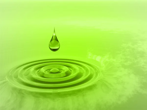 Drop falling in water with ripples