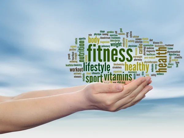 Concept or conceptual abstract fitness and health word cloud man hand, blue sky background