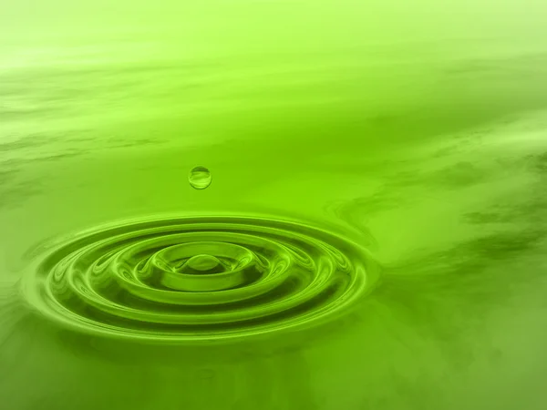 Green liquid drop falling