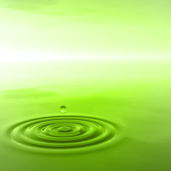 Green liquid drop falling