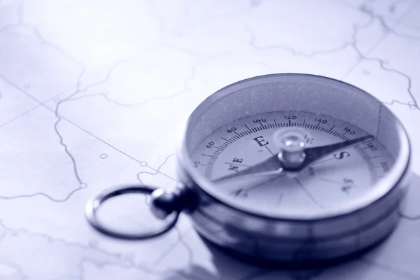 Close Up of Needle Compass on Line Map