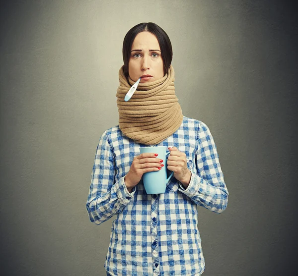 Woman in scarf have a flu