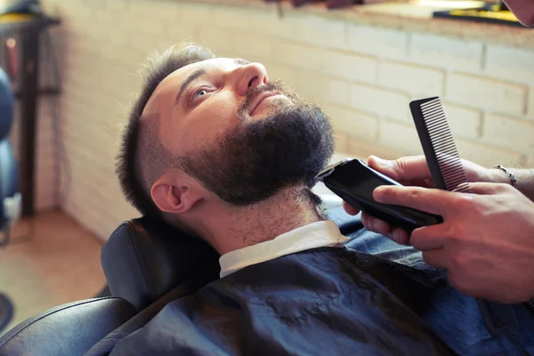 Barber with comb and electric razor