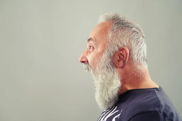 Screaming senior man with grey-haired beard