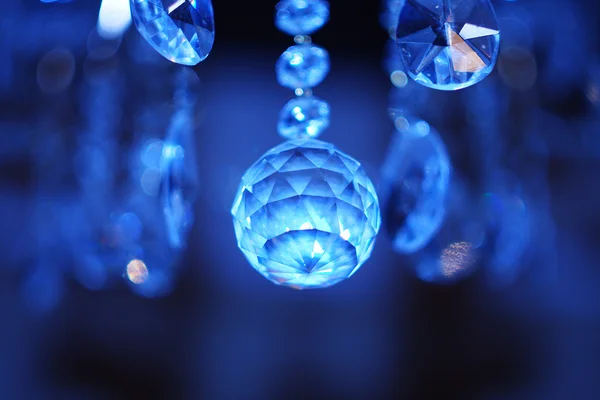 Blue diamonds suspended from the ceiling