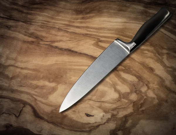 Knife on vintage cutting board
