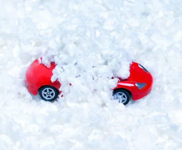 Toy car strewn with artificial snow