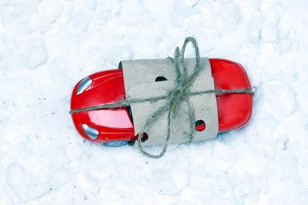 Toy car packed as a gift for artificial snow