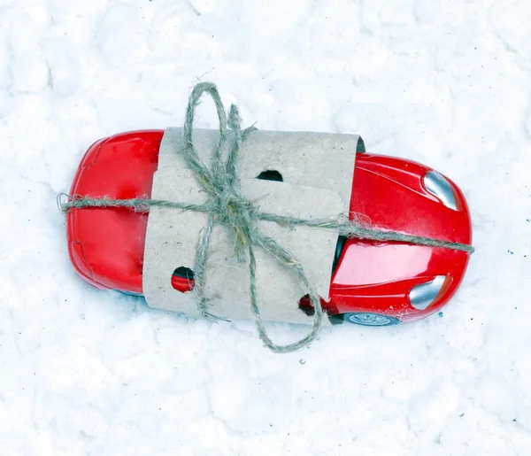 Toy car packed as a gift for artificial snow.