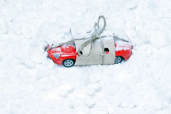 Toy car strewn with artificial snow