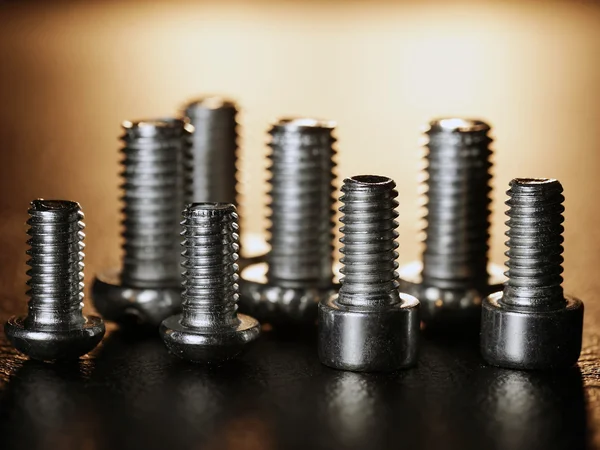 Nuts and bolts on a black background