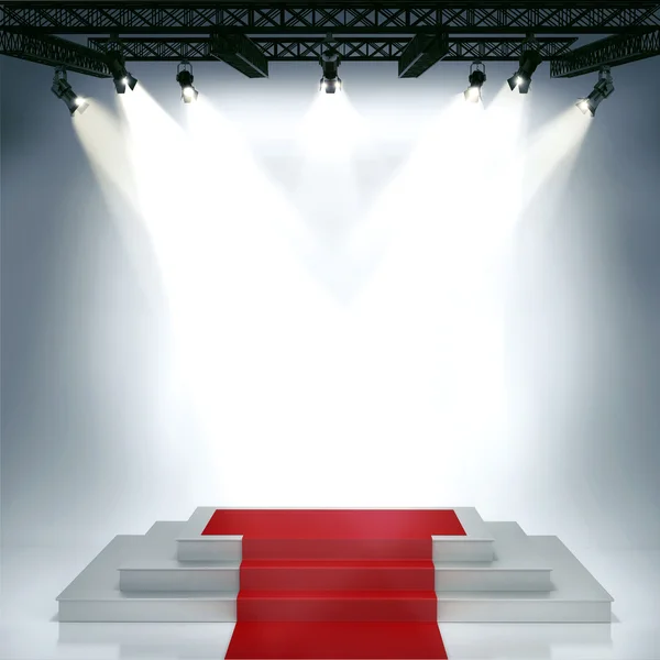Illuminated empty stage podium with red carpet for award ceremony