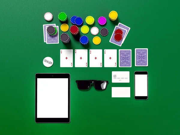 Cards and chips for poker on green table